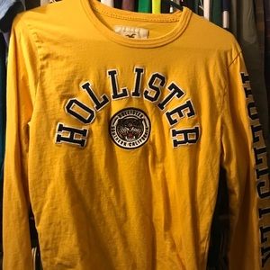 Yellow long sleeve men's Holliatwr shirt.  XS